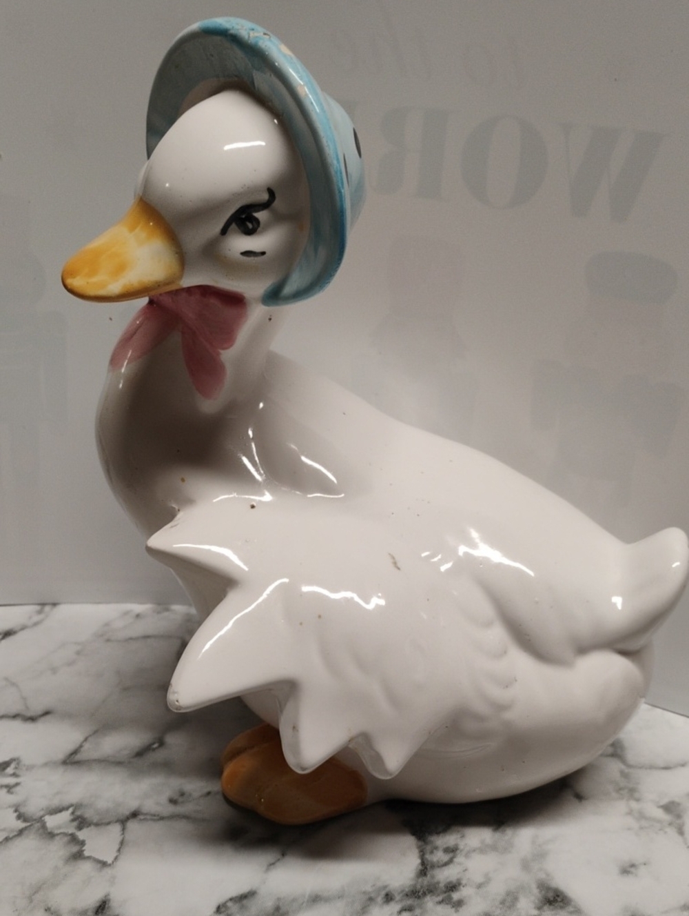 Glossy White Ceramic Duck with Blue Bonnet and Pink Bow